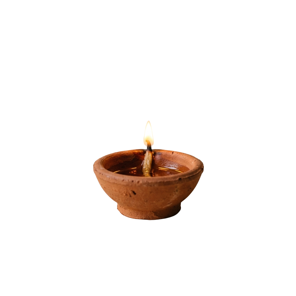 A small clay diya with a lit wick inside, glowing softly against a dark background