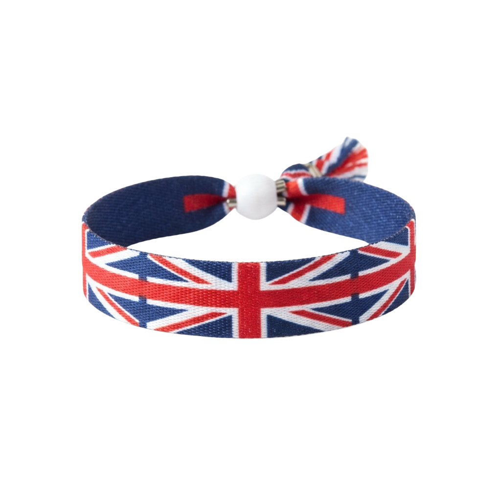 A wristband featuring the Union Jack flag design with a white adjustable buckle closure