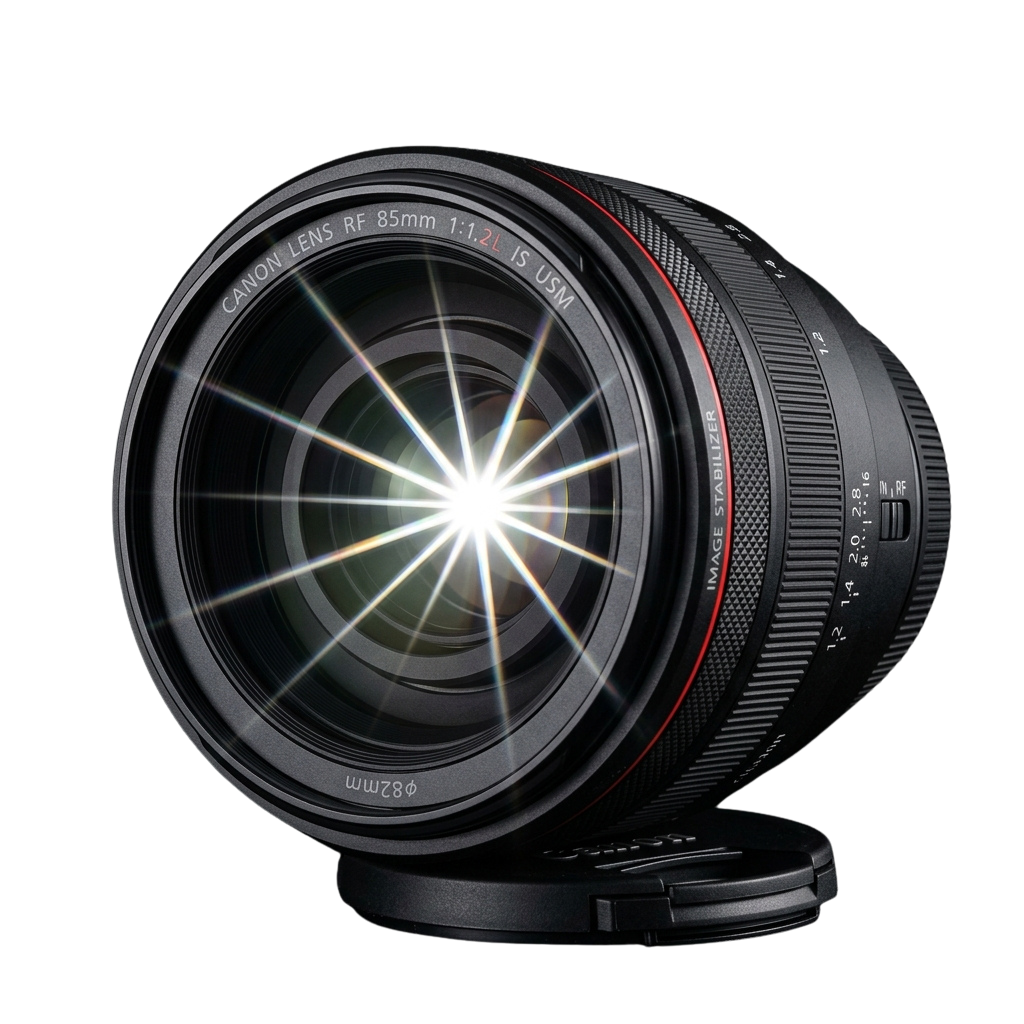 A black camera lens with 85mm focal length and bright light flare pattern inside the lens barrel