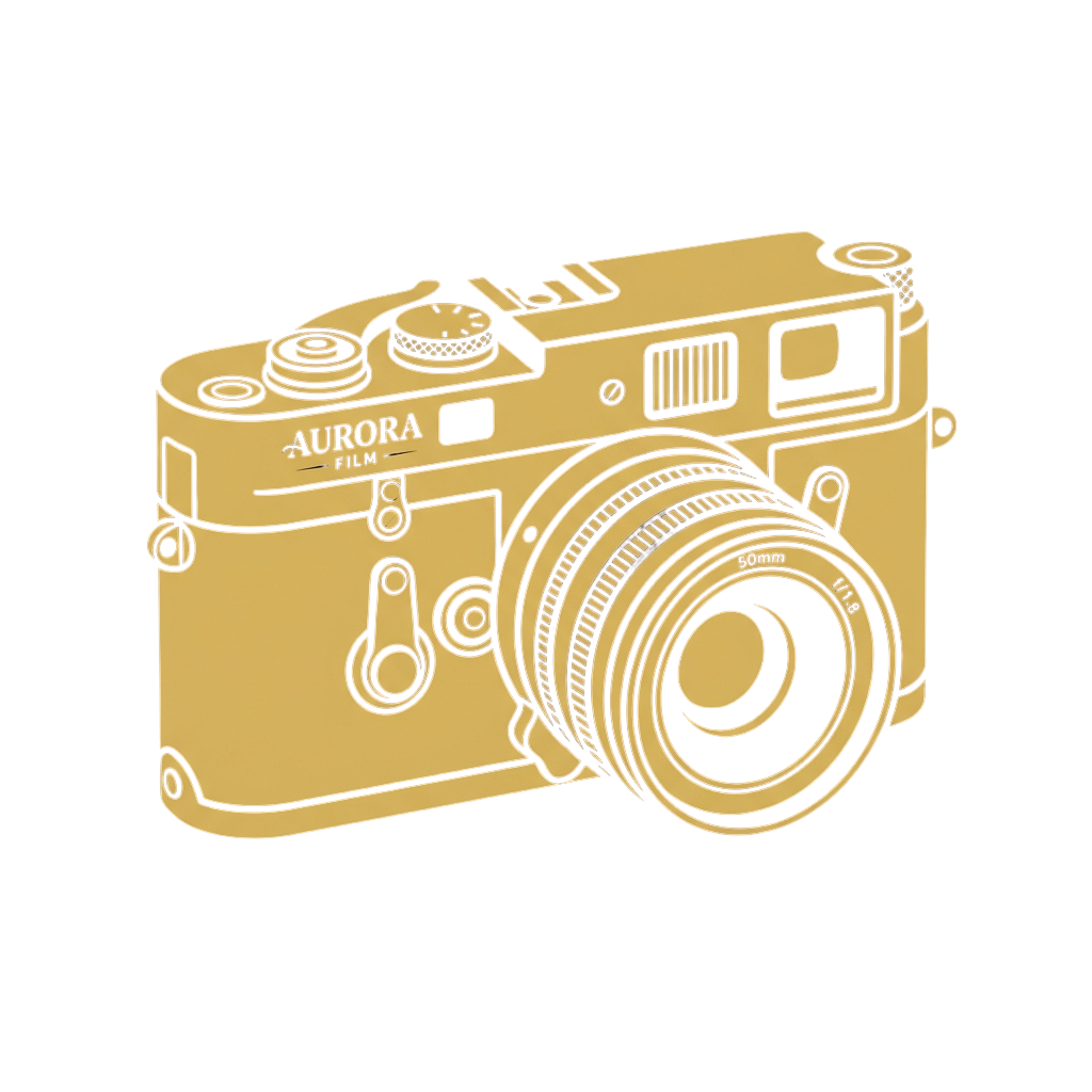 A gold outlined illustration of a vintage film camera with a large lens and classic design elements