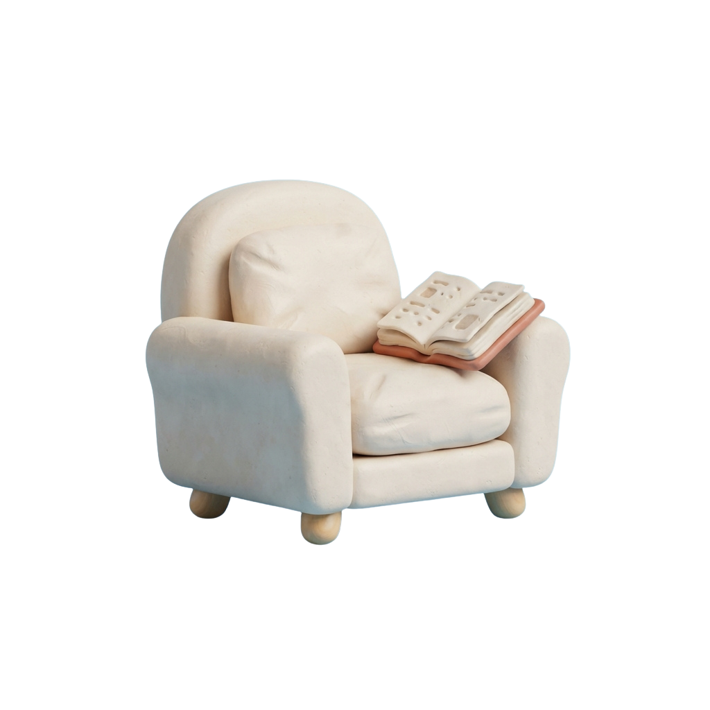 A light-colored armchair with an open book resting on its right arm.