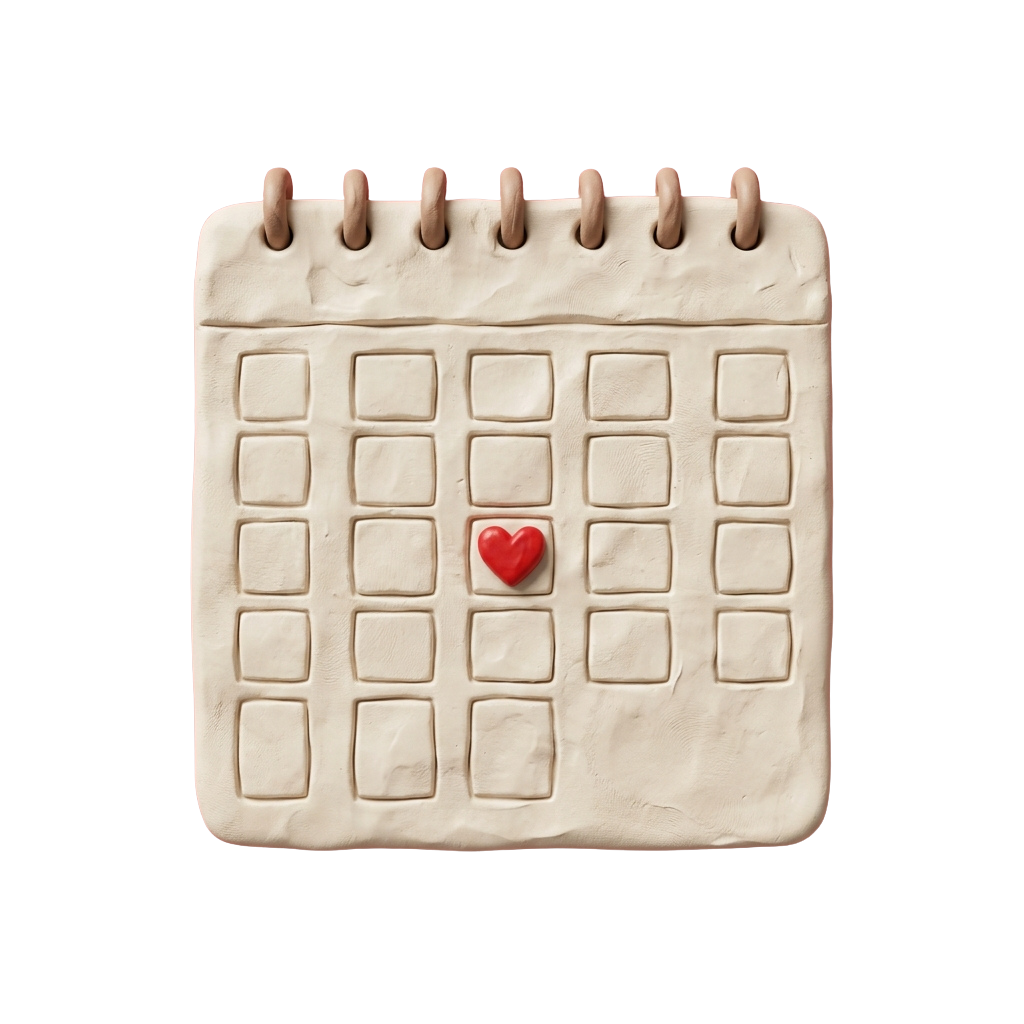 A sculpted calendar with a red heart placed in the center square on a neutral background