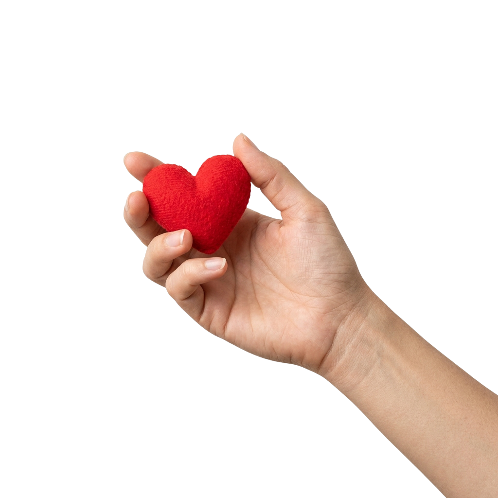 A hand holding a small red heart-shaped plush toy against a black background