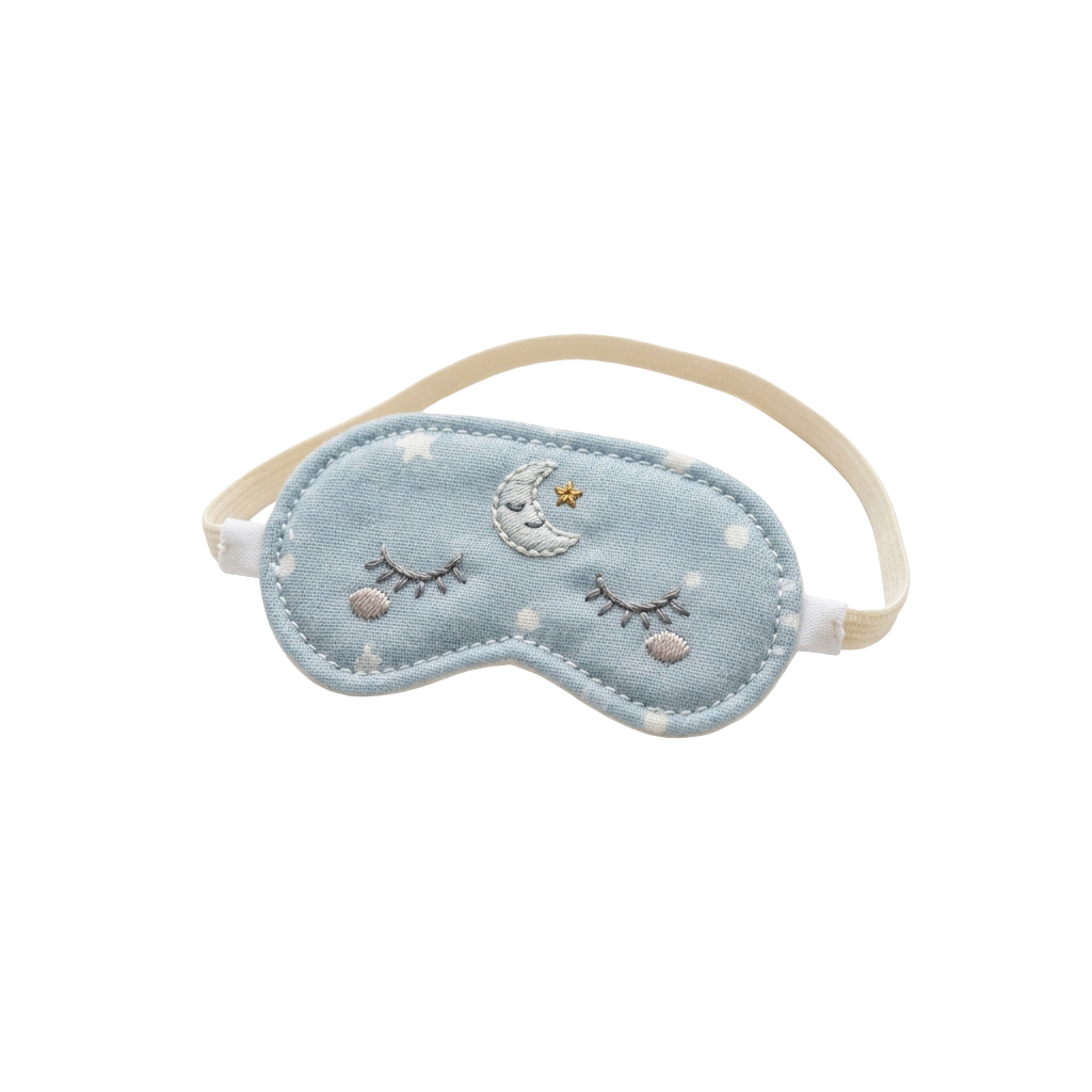 A light blue sleep mask with embroidered moon and stars