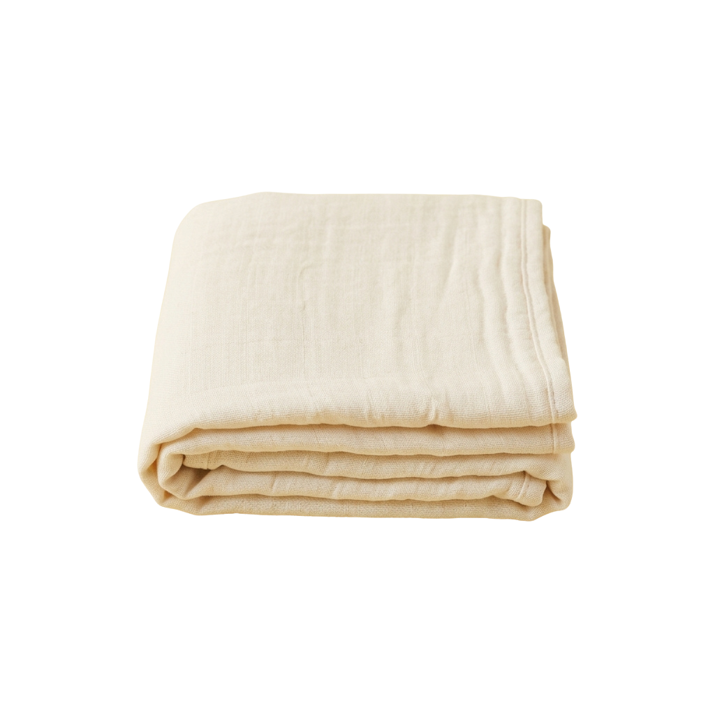 A stack of folded cream-colored fabric