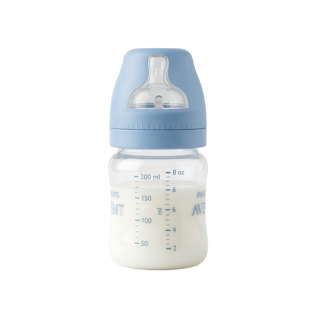 A baby bottle filled with milk and a blue cap on a black background