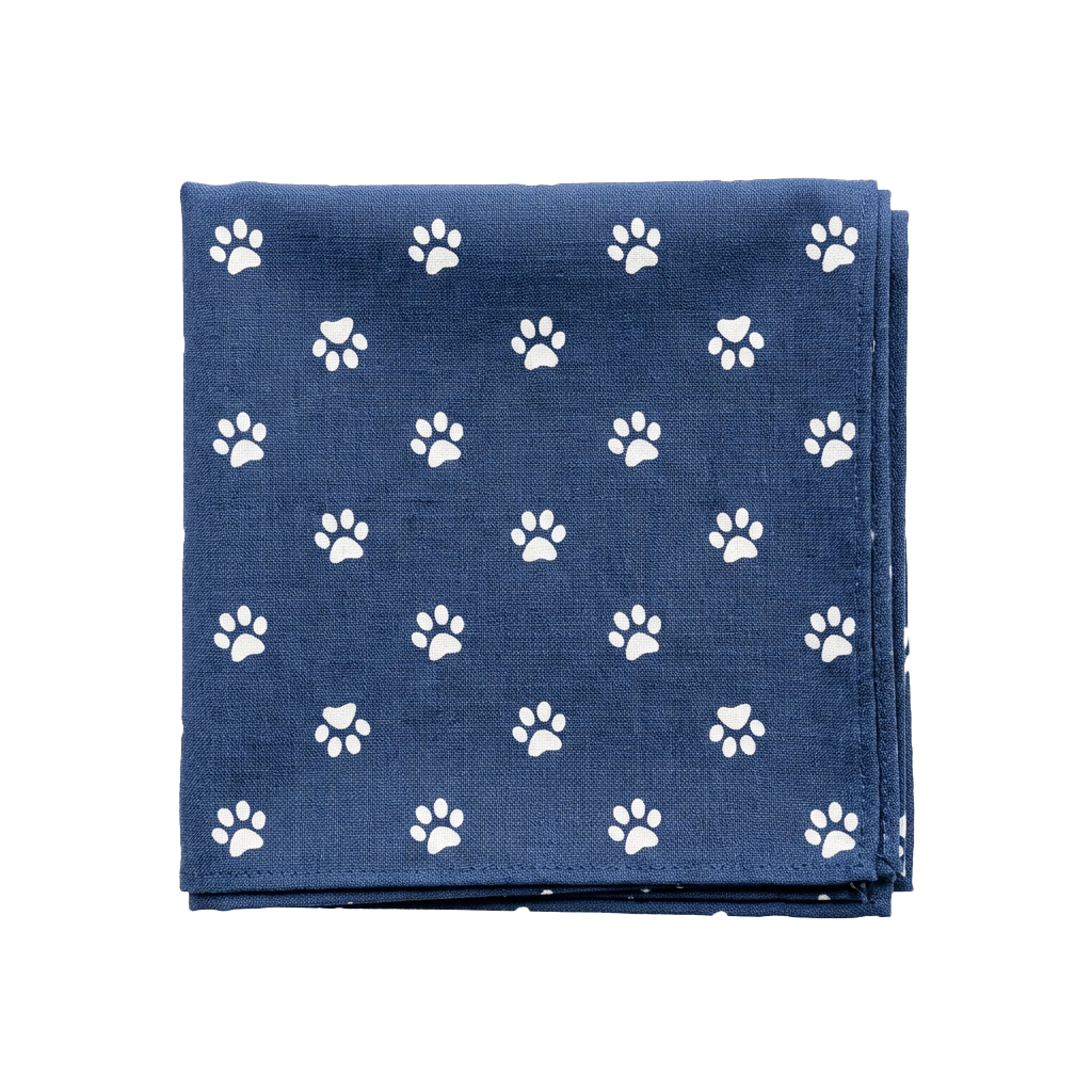 Square napkin with blue background and white paw print pattern