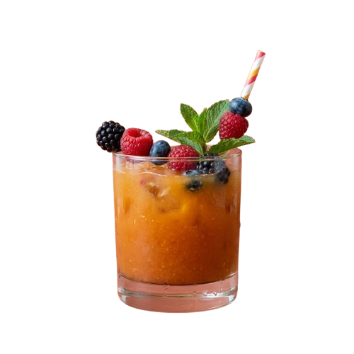 A tall glass filled with a fruity orange-colored drink garnished with raspberries, blackberries, blueberries, and mint leaves
