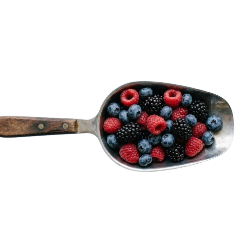 Metal serving scoop filled with fresh raspberries, blackberries, and blueberries on a black background