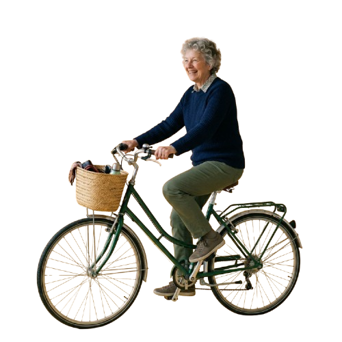 Smiling older woman riding a green bicycle with a basket attached to the front handlebars