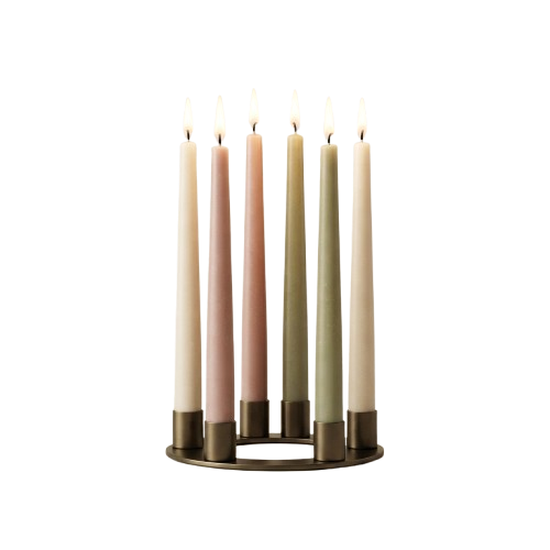 Five lit candles in different pastel colors placed in a metallic holder against a dark background