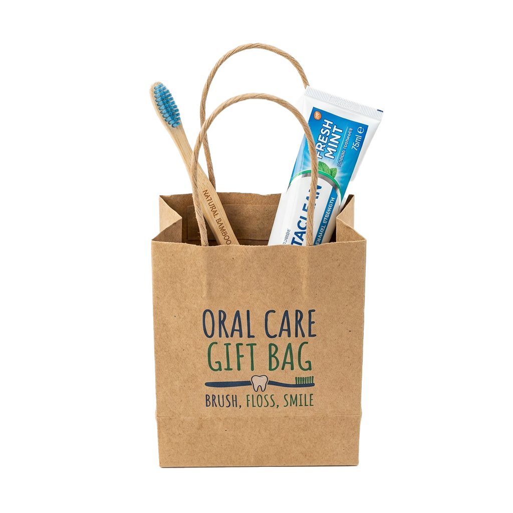 Brown paper bag labeled Oral Care Gift Bag containing bamboo toothbrush, dental floss, and mint toothpaste