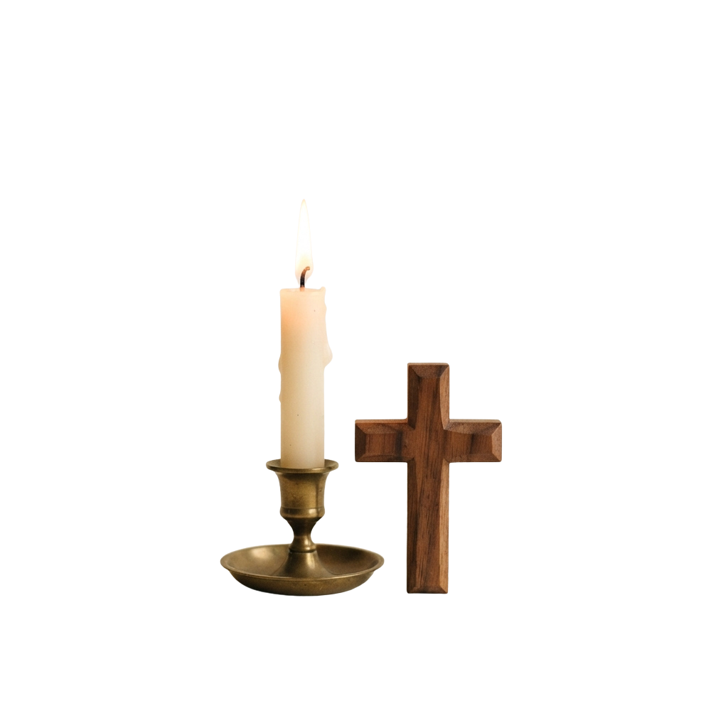 A lit candle in a brass holder beside a wooden cross on a dark background