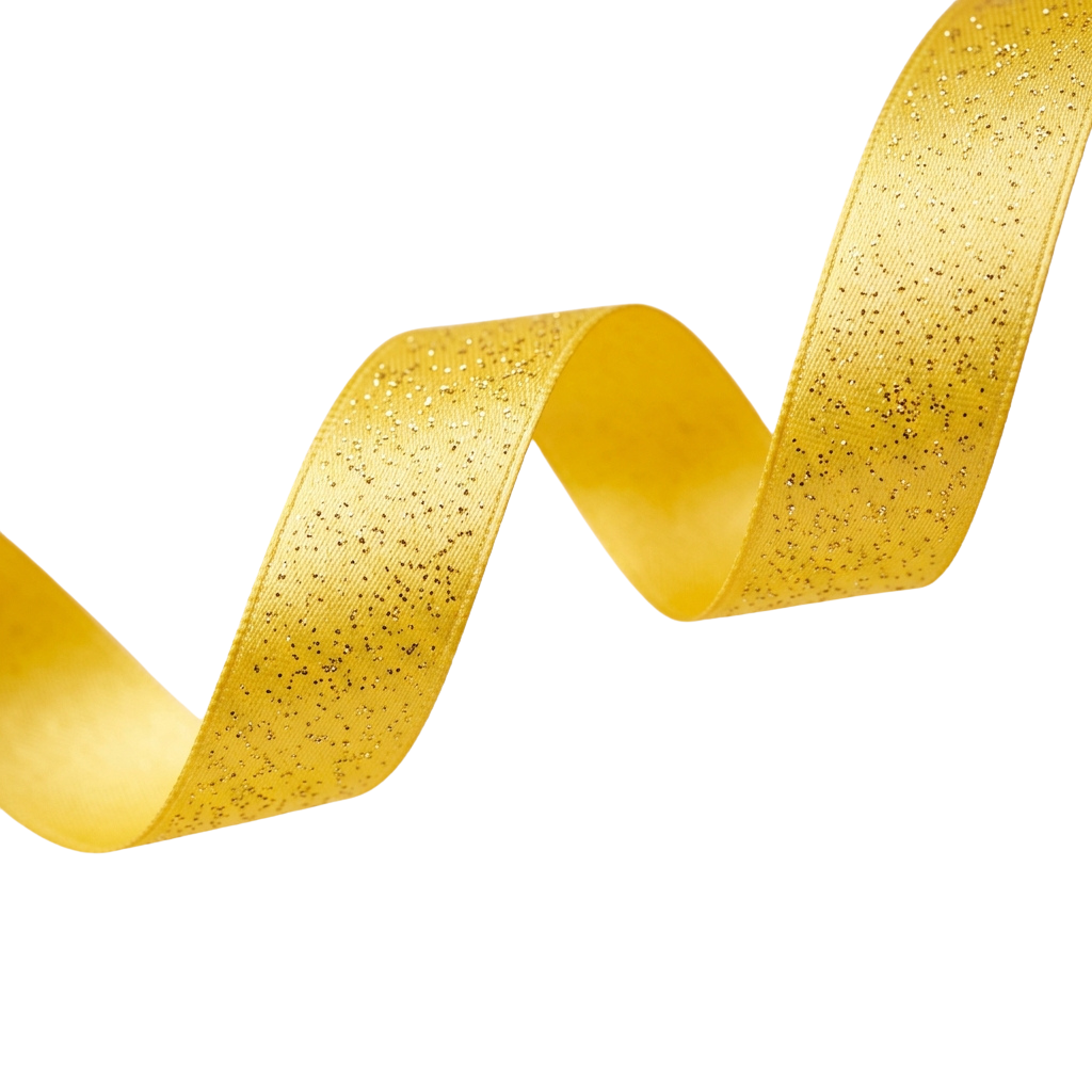 A shiny golden glitter ribbon curled in a smooth wave against a black background