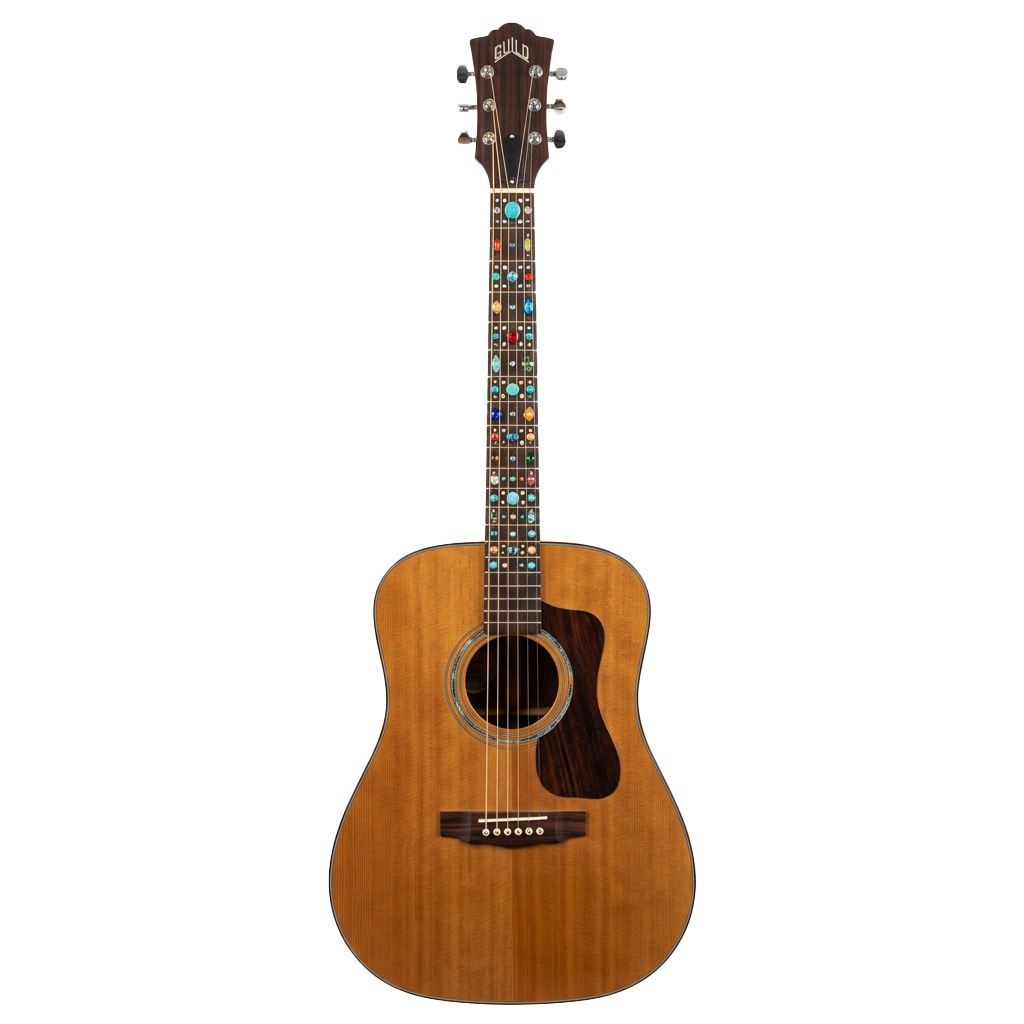 A light brown acoustic guitar with a round sound hole and decorative inlays on the neck.