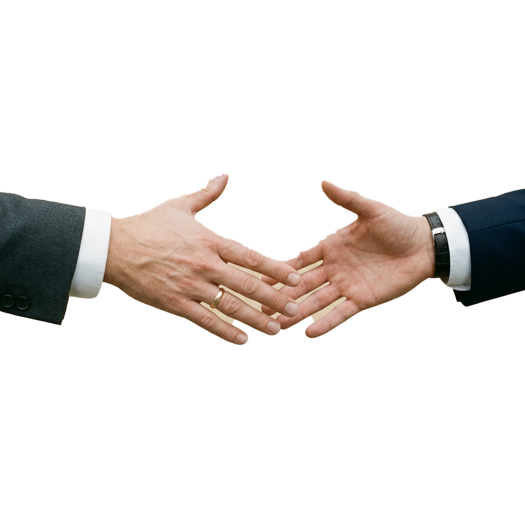 Two people shaking hands in a business setting, dressed in formal attire.