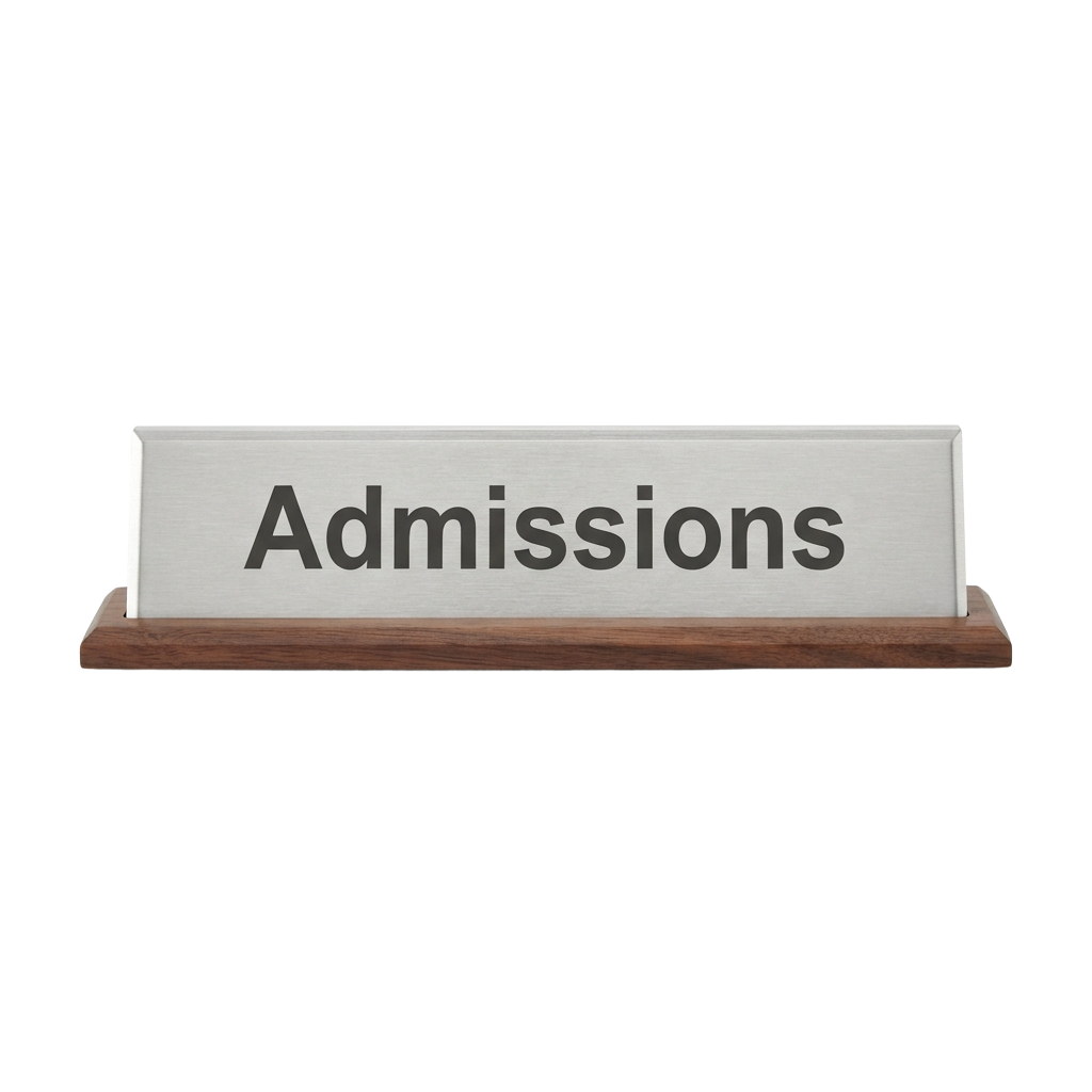 A rectangular wooden-framed sign with the word Admissions printed on it