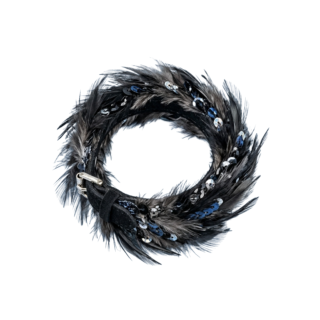 A stylish circular wreath made of black feathers with silver accents and small decorative elements.