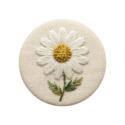 A detailed embroidered daisy flower with white petals, yellow center, and green stem on a beige fabric background