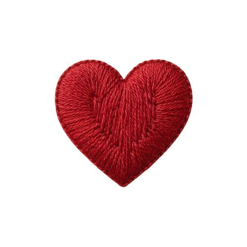 A heart-shaped patch made of red velvet-like textured fabric against a black background