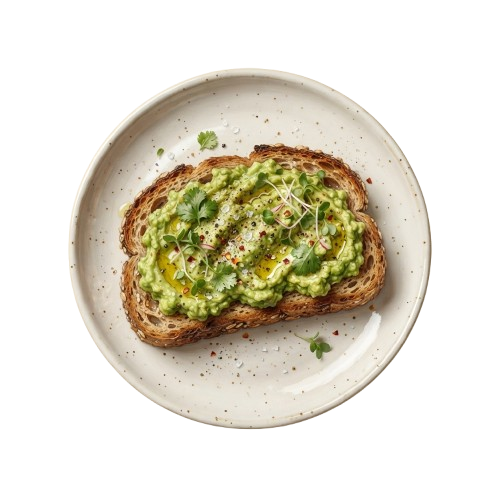 A slice of toast topped with green avocado spread and garnished with herbs on a white plate
