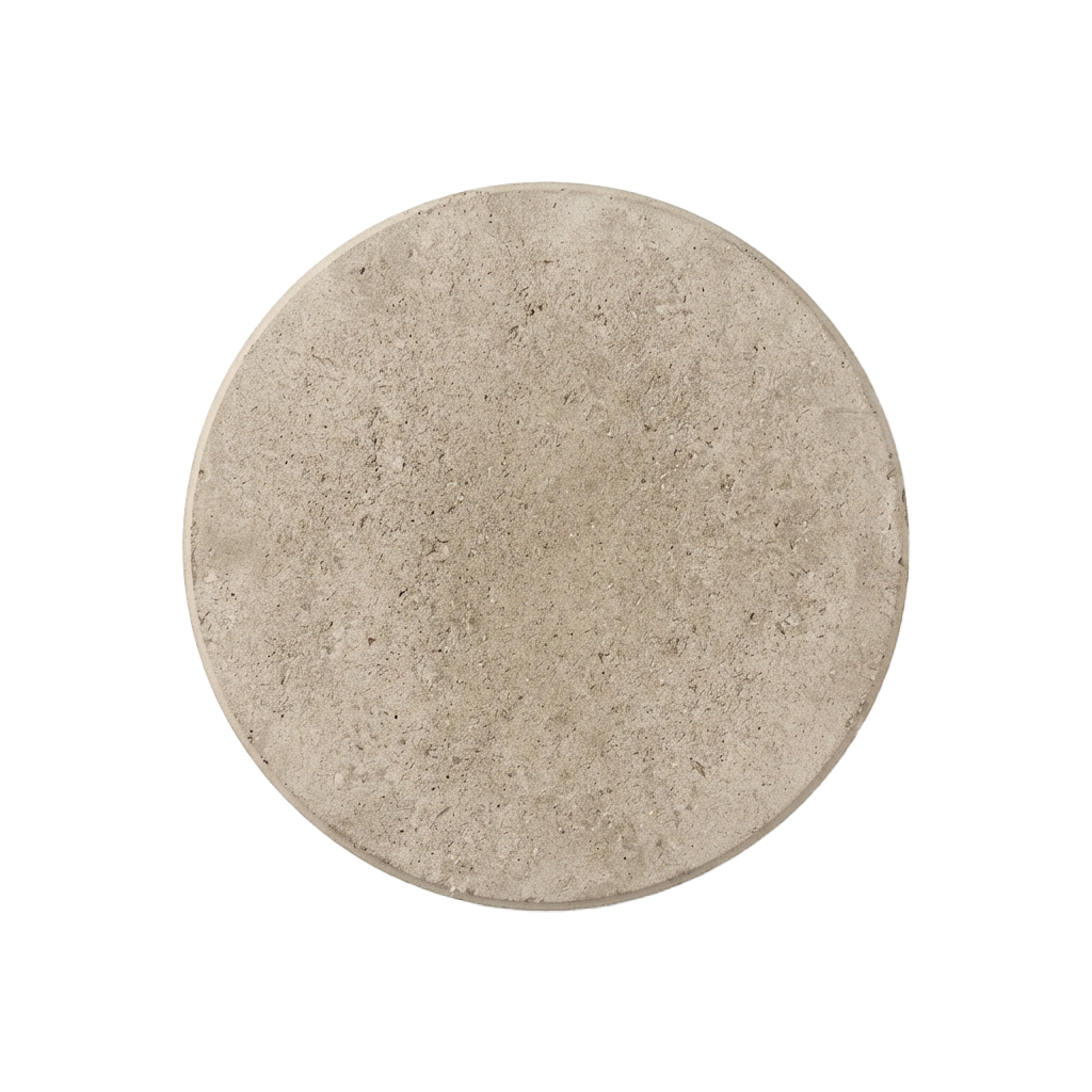 Close-up of a smooth, round, light-colored concrete or stone slab with a textured surface