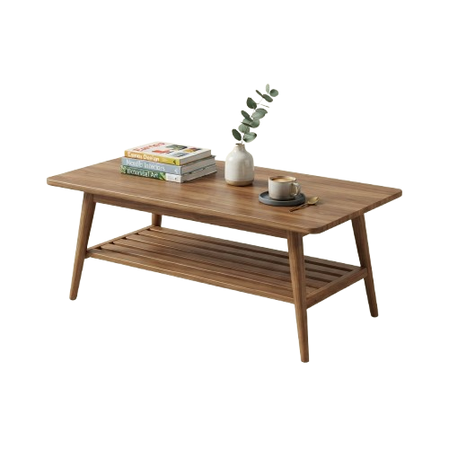 A light wooden coffee table with a lower shelf, displaying books, a small vase with greenery, and a cup on a saucer.