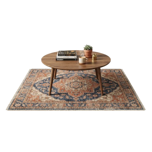 Round wooden coffee table on a decorative rug with books, a cup, and a small potted plant on top