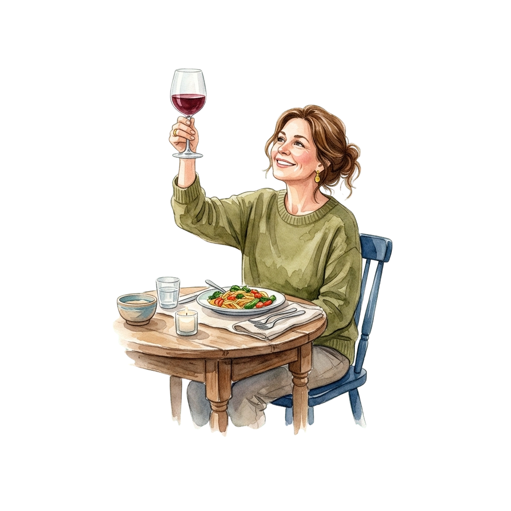 A woman sitting at a table holding a glass of red wine, smiling while enjoying a meal with a plate of food and a bowl of soup