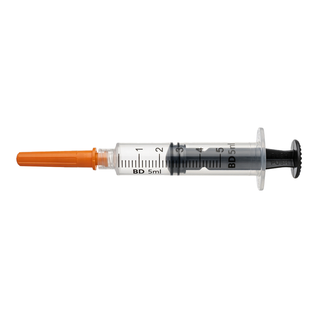 A 5 milliliter syringe with an orange needle tip against a black background