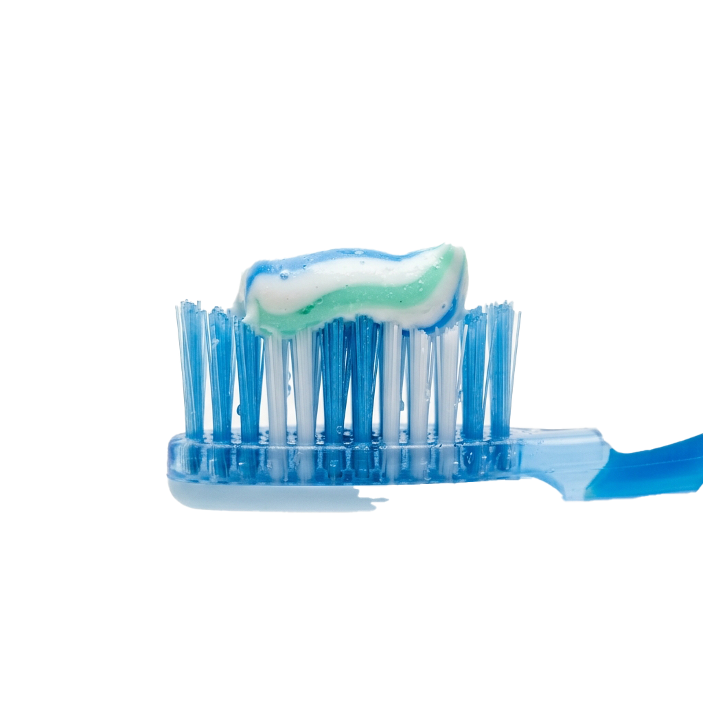 A blue toothbrush with mint-colored toothpaste applied to the bristles
