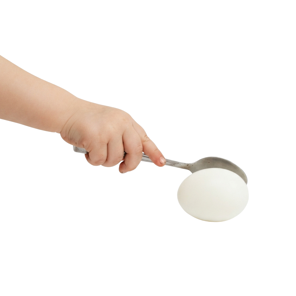 A hand holding a metal measuring spoon filled with a white powdered substance.