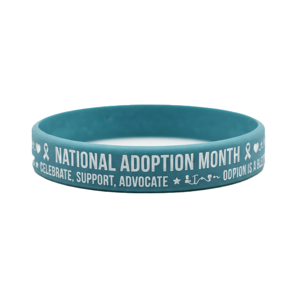 Light blue wristband with white text reading National Adoption Month and related messages