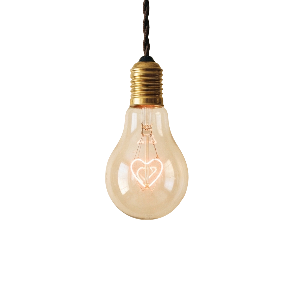 A hanging decorative light bulb with a heart shape inside glowing softly against a dark background