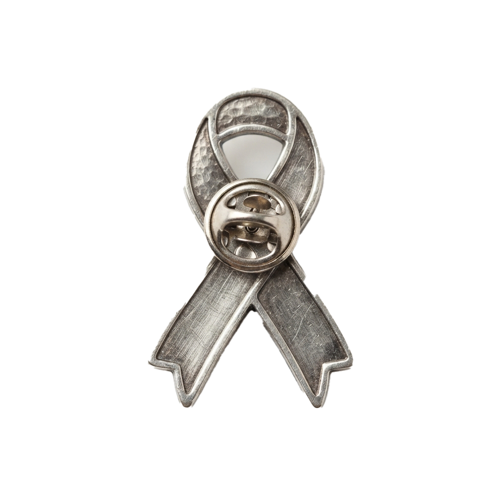 A silver awareness ribbon pin with a circular design in the center and a textured finish.