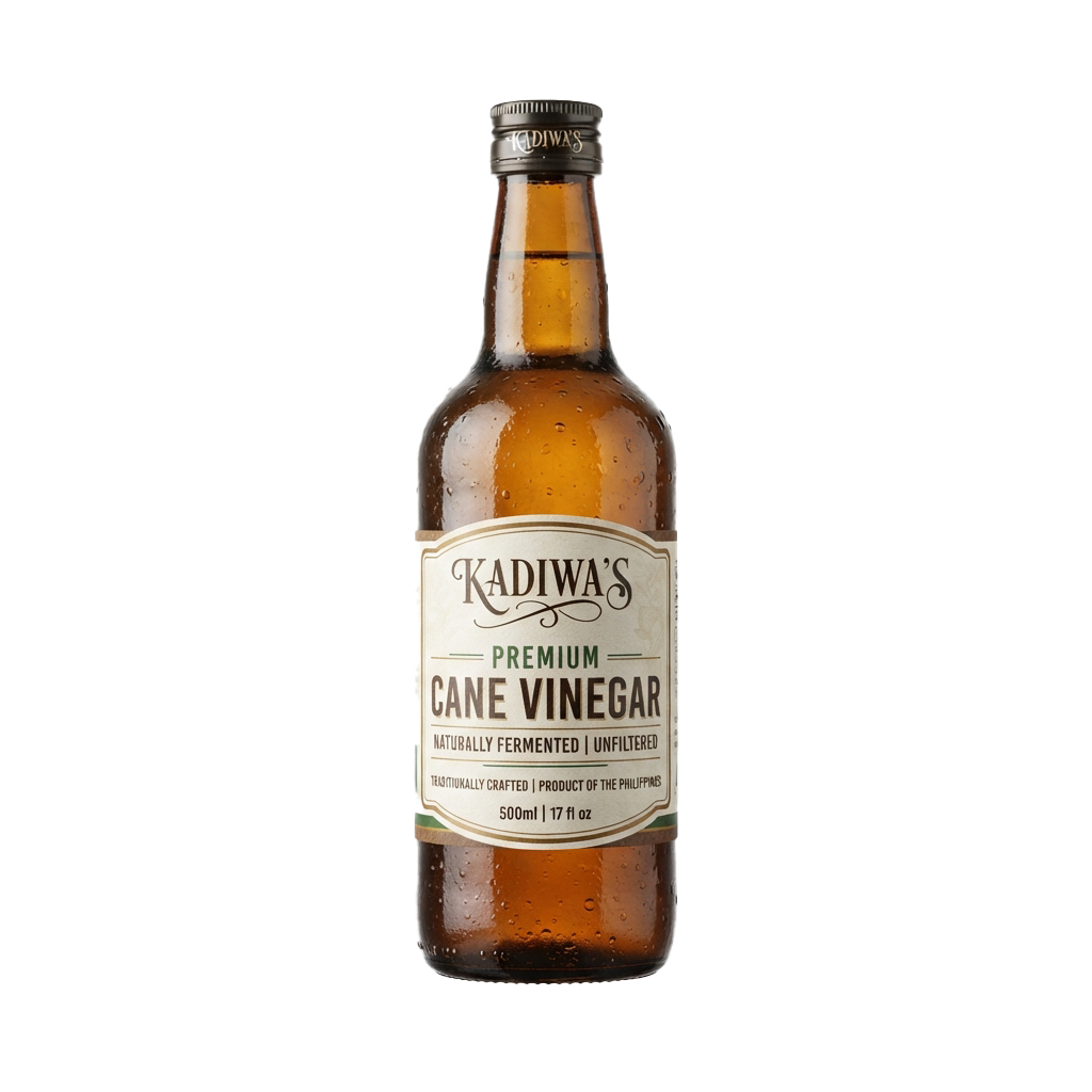 A brown glass bottle of cane vinegar labeled as premium, naturally fermented, and unfiltered.
