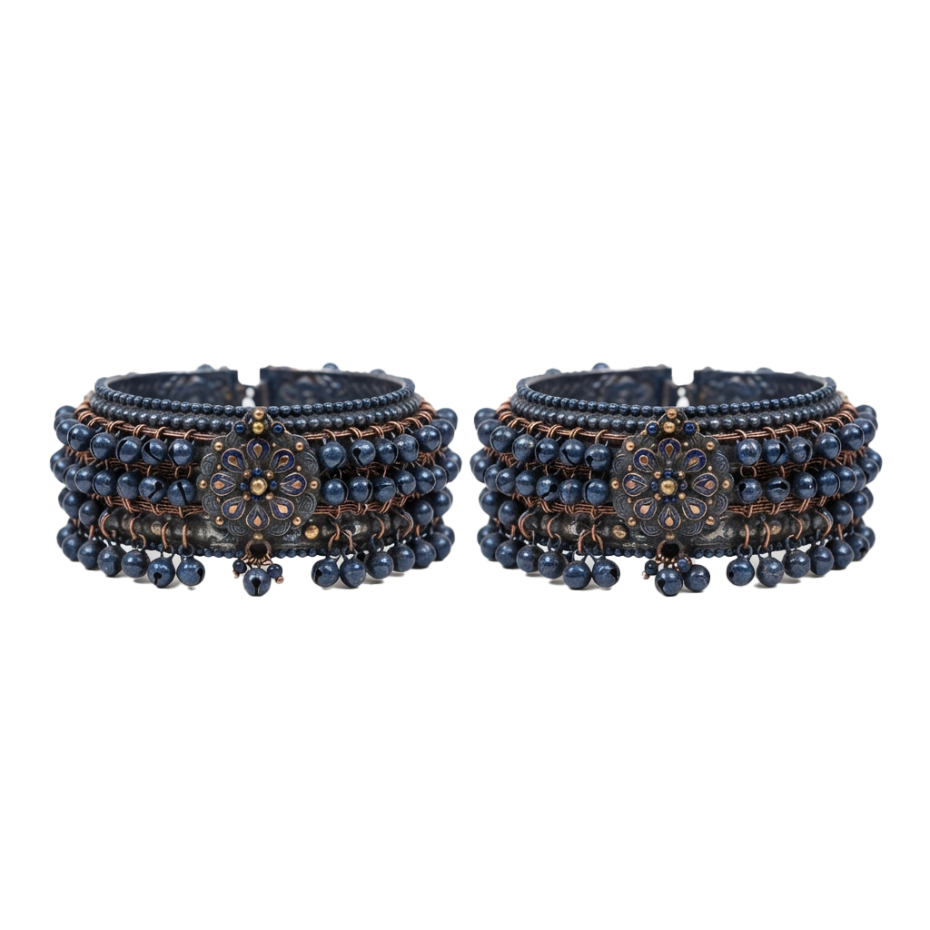 Two intricately designed blue beaded bangles featuring copper wire and floral patterns.