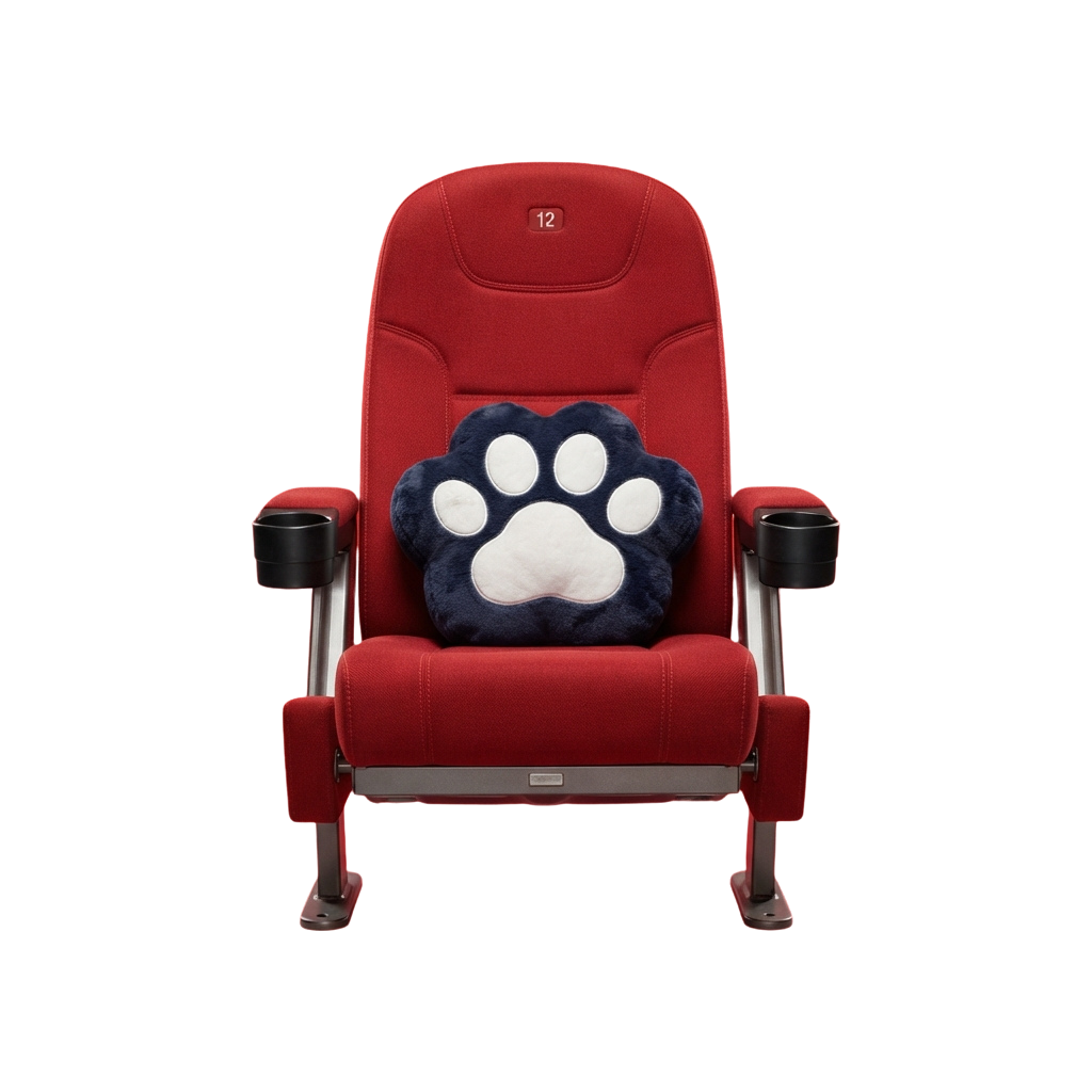 Red reclining theater seat with a blue and white paw print cushion on the headrest