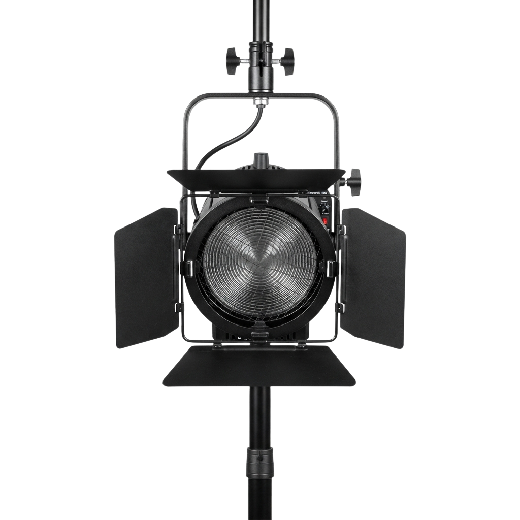 A black studio fresnel light mounted on a stand with barn doors attached for directional lighting control