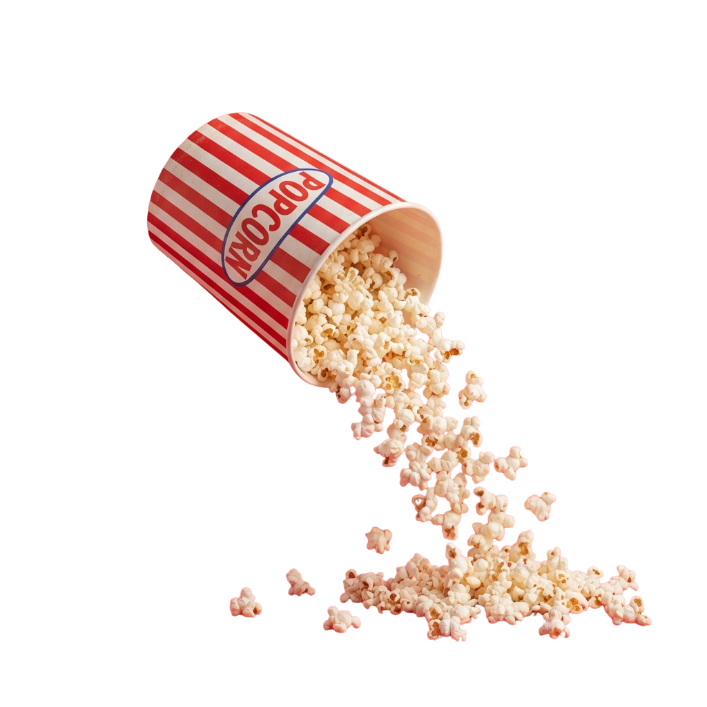 Popcorn spilling out of a striped paper bucket against a black background