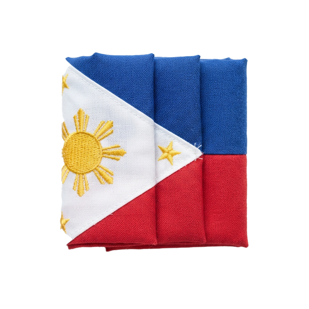 Three folded fabric pieces displaying the Philippine flag with blue, white, red stripes and yellow sun emblem