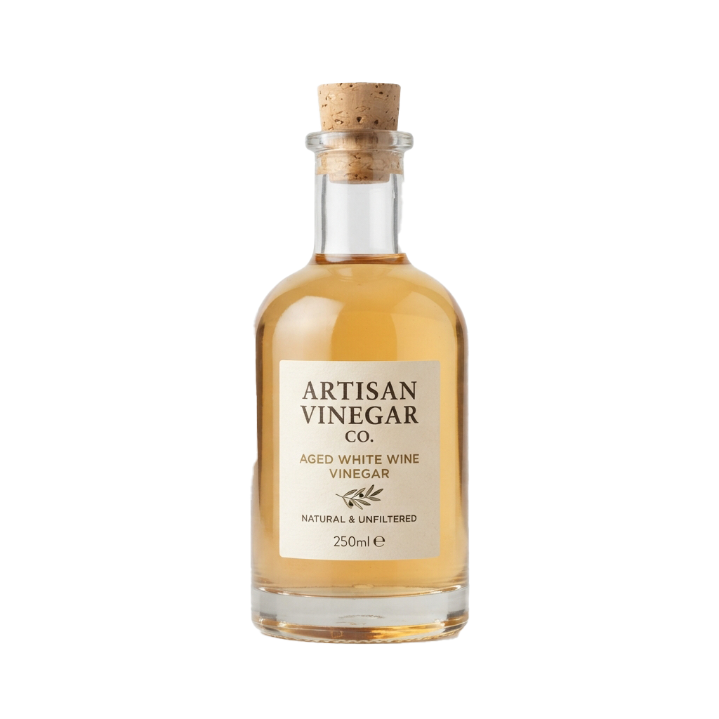 A glass bottle of aged white wine vinegar with a cork stopper and a white label