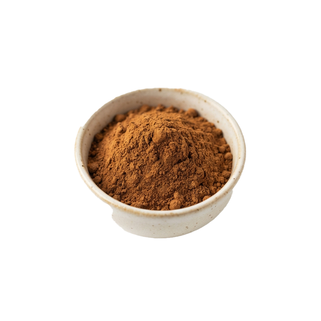 Small white bowl filled with ground cinnamon powder against a black background