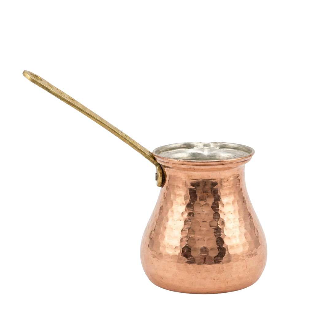 A copper cezve with a wooden handle used for brewing Turkish coffee