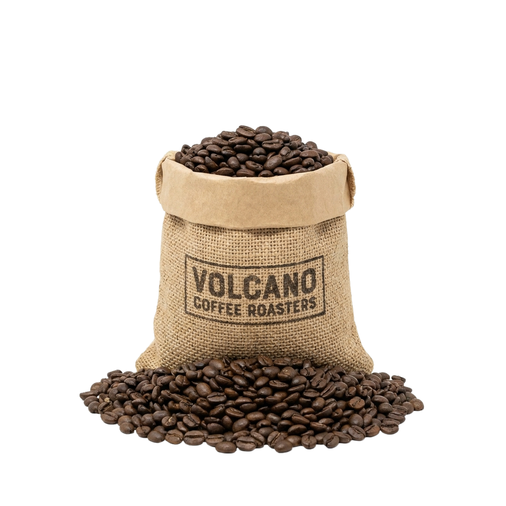 A burlap sack filled with dark roasted coffee beans spilling out onto a black background