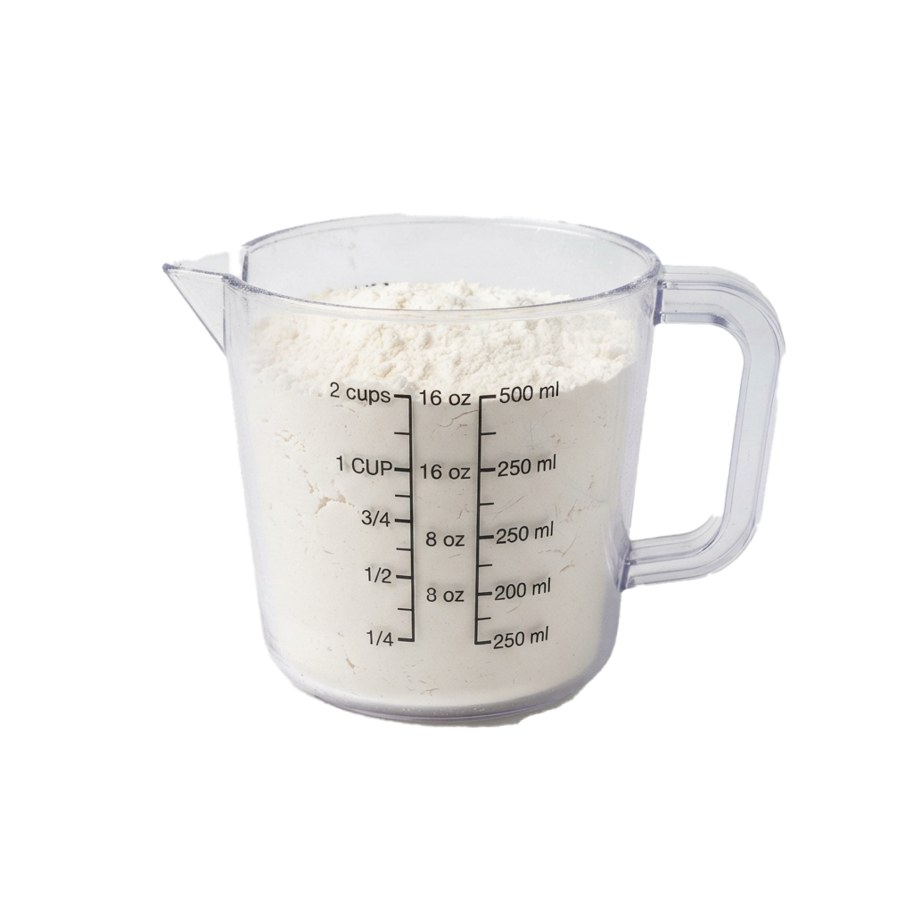 A clear plastic measuring cup filled with white flour up to the 1 cup mark