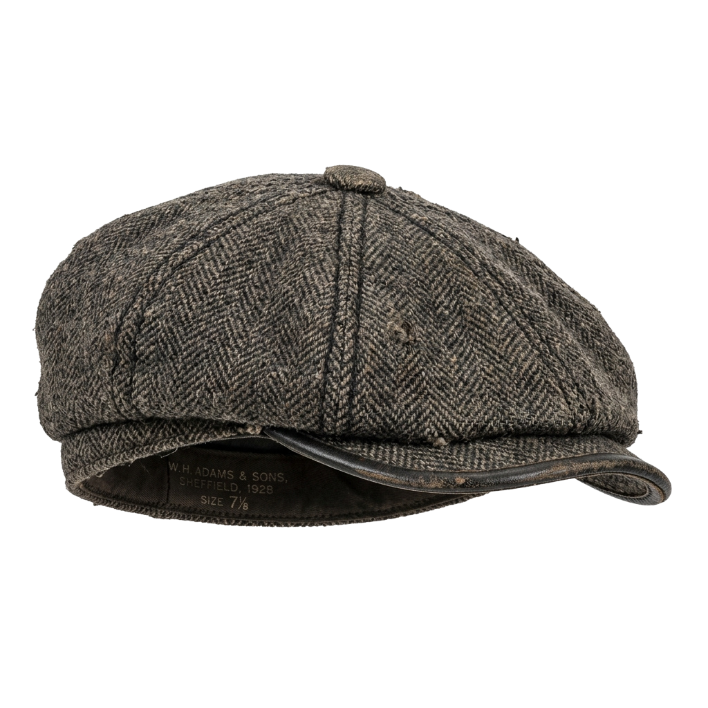 A vintage tweed flat cap with a herringbone pattern and a leather band, size 7 7/8