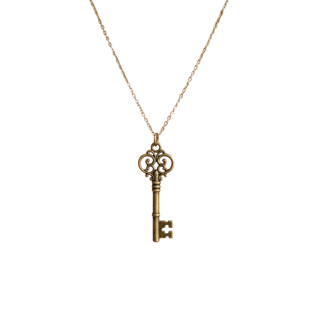 A gold-toned key-shaped pendant with ornate detailing hanging from a thin chain.