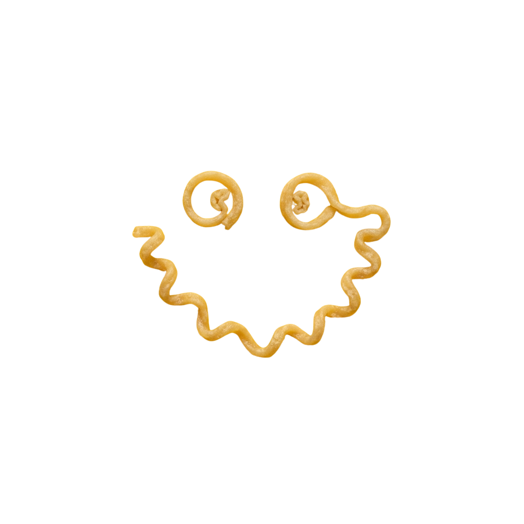 A cheerful ghost face made from wavy pasta with two small pasta circles for eyes
