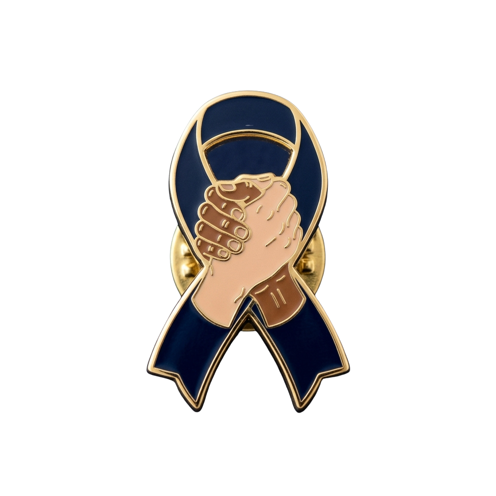 Enamel pin featuring clasped hands inside a blue ribbon shape with gold accents